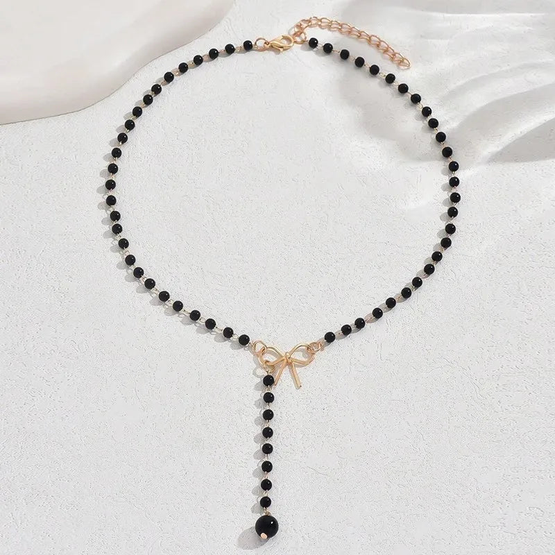 Midnight Bow Necklace – Black Beaded Y-Chain Pendant