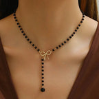 Midnight Bow Necklace – Black Beaded Y-Chain Pendant