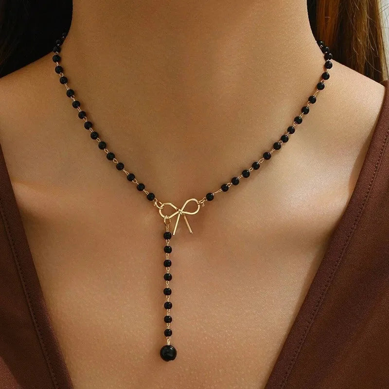 Midnight Bow Necklace – Black Beaded Y-Chain Pendant